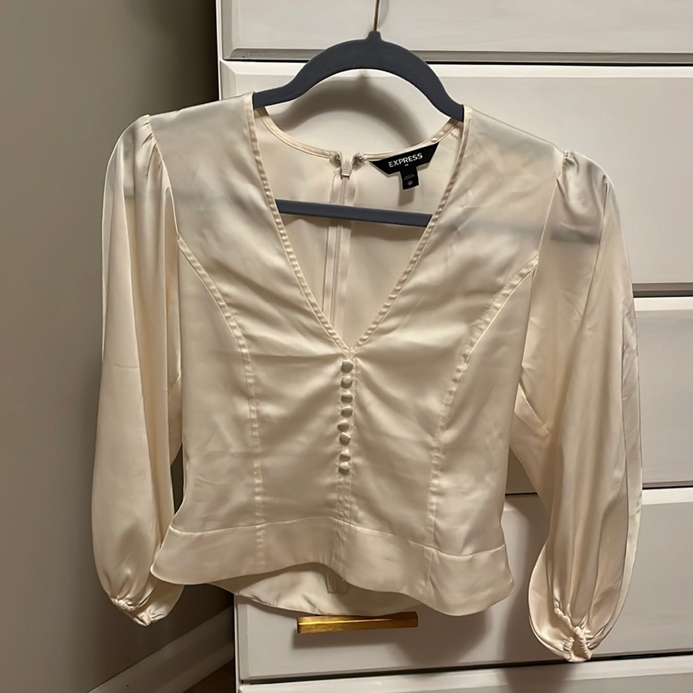 Cream silk blouse with slightly puffy sleeves